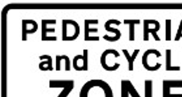 First sign shows a pedestrian and cycle zone banning motor vehicles. Second sign is blue and shows a school street no motor vehicles ahead with a left hand pointing arrow. Third sign shows a camera. The first two signs give the days and times restrictions in place - Monday to Friday, 8.15am to 9.15am, 2.45pm to 3.45pm